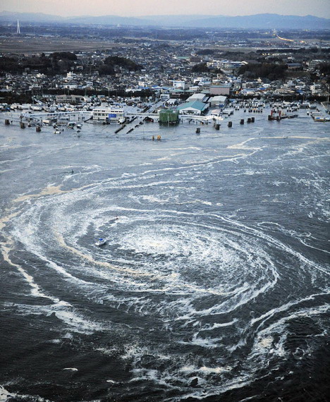 a_small_boat_gets_stuck_in_a_tsunami_whirlpool