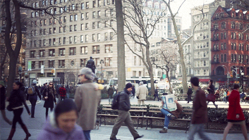 top_40_cinemagraphs_busy_day_in_manhattan_but_there_s_always_time_for_the_paper